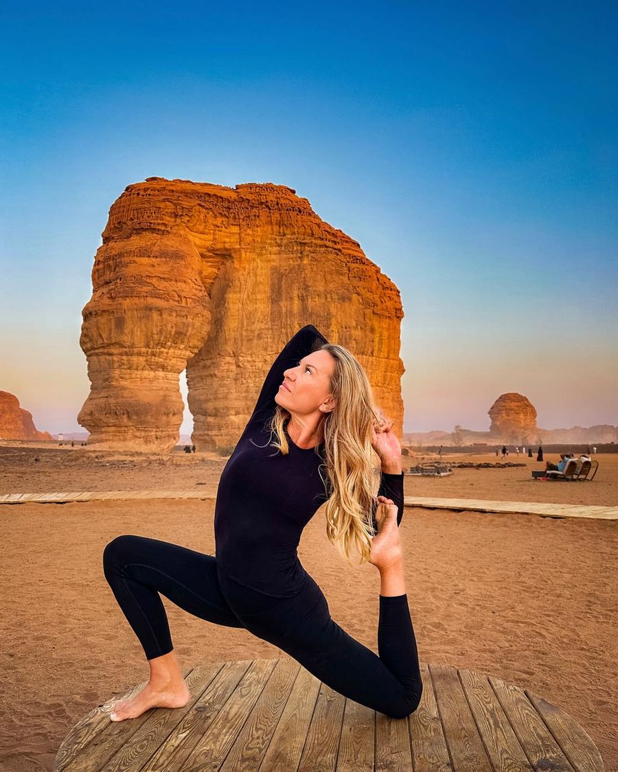 Vanessa Roux in a yoga pose in front of Elephant Rock
